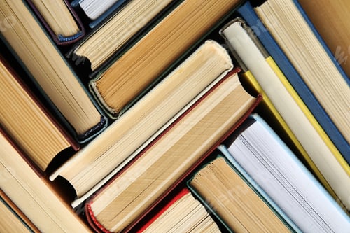 Preview: Many different hardcover books as background, top view