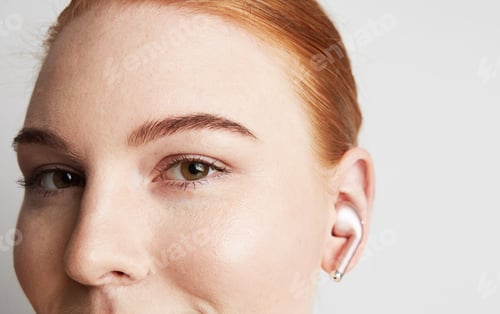 Preview: Portrait of charming redhead woman with romantic smile and closed eyes listening music