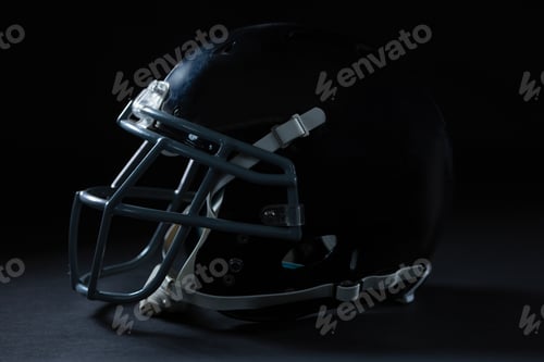 Preview: American football head gear on a black background