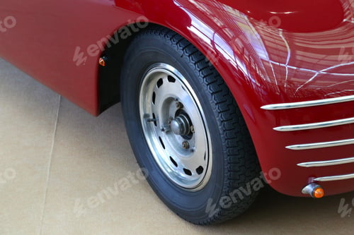 Preview: High angle shot of the front part of a red car