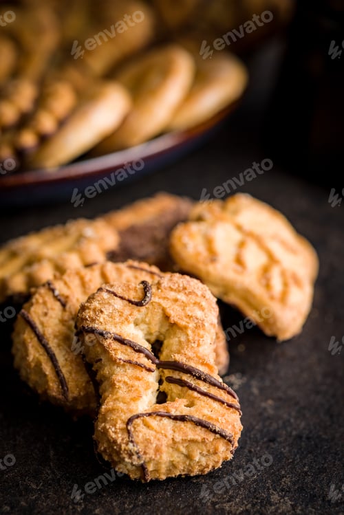 Preview: Assorted various cookies. Sweet biscuits on black table.