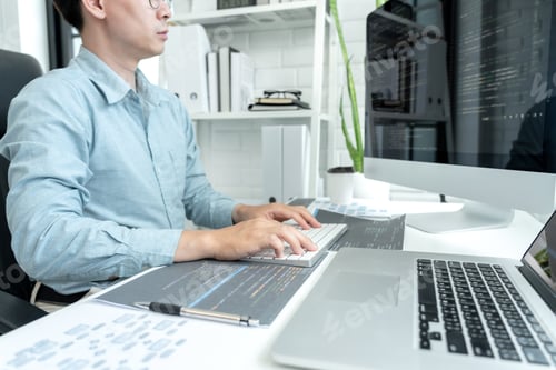 Preview: Male programmer is programing to developing program app and website of corporate while working