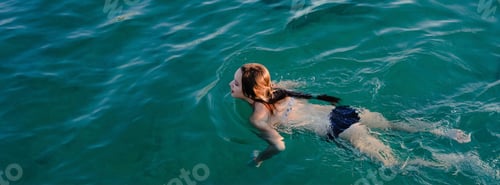 Preview: Teenage girl swimming in the sea. Summertime, outdoor activity, vacation, travel, sport banner. N