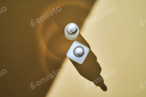 Preview: Two bottles of serum on a beige background with a beautiful shadow.