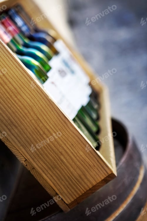 Preview: Five empty bottles in a wooden box