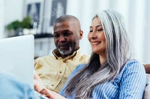 Preview: Cinematic image of an happy multiethnic senior couple.