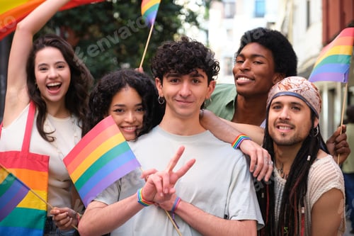 Preview: Young activists showing rainbow flags at LGBT pride parade
