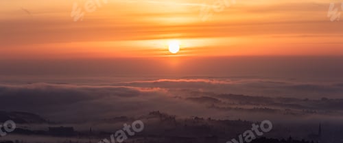 Preview: Panorama of Graz city covered if fog on autumn morning during sunraise