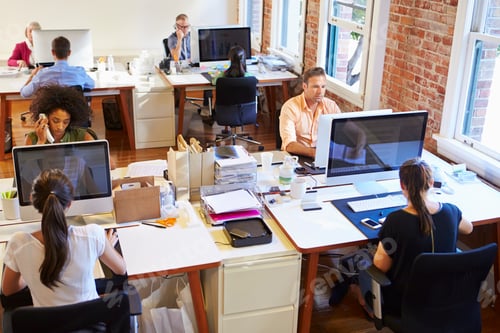 Preview: Wide Angle View Of Busy Design Office With Workers At Desks