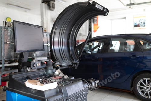 Preview: Photo of a machine for balancing wheels and repairing tires of an auto against the background of a