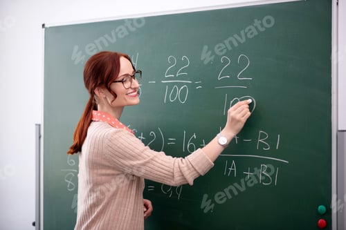 Preview: Smiling math teacher explaining new topic to her pupils