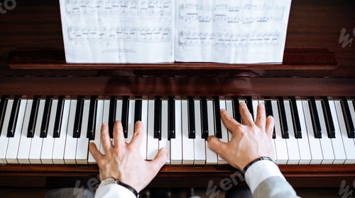 Preview: Crop male hands playing piano