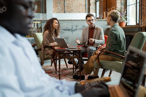 Preview: Three managers discussing their ideas by table