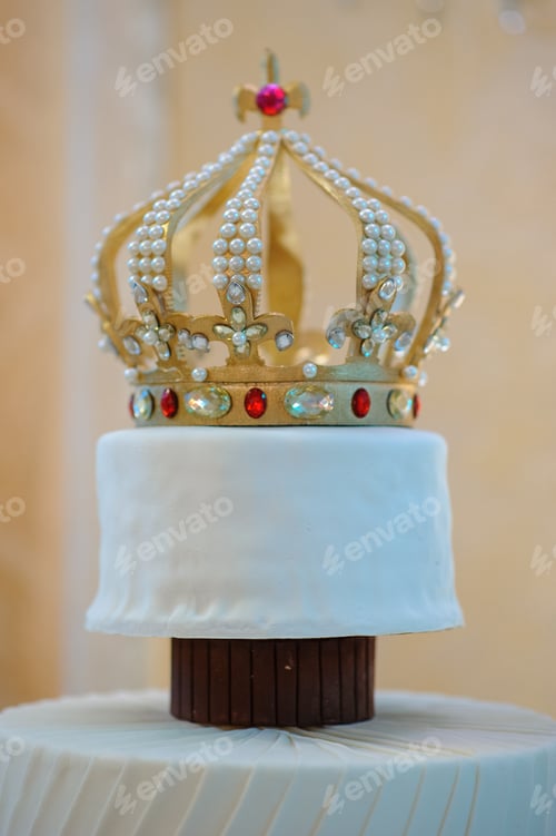 Preview: Wedding cake with luxury decorated in wedding party. Cake decorated with crown