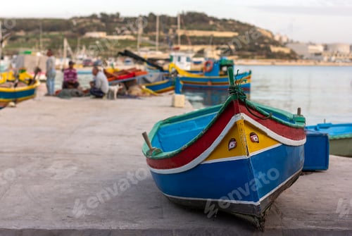 Preview: Traditional maltese boat in harbour in sunny day in Marsaxlokk fishers village