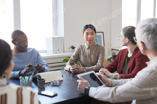 Preview: Diverse Team of Business People in Meeting