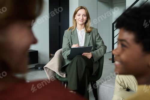 Preview: Smiling Professional Holding Tablet During Business Meeting