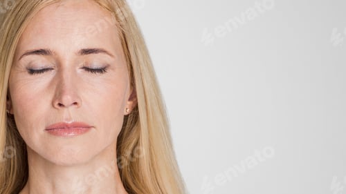 Preview: Close Up Portrait of a Blonde Woman With Eyes Closed