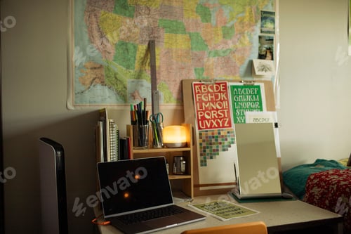 Preview: Cozy working and study corner in the bedroom with a desk, laptop and supplies
