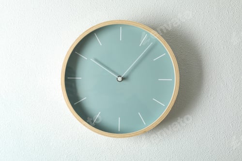 Preview: Big beautiful stylish clock hanging on light background, space for text