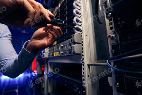 Preview: Engineer installing network equipment in data center