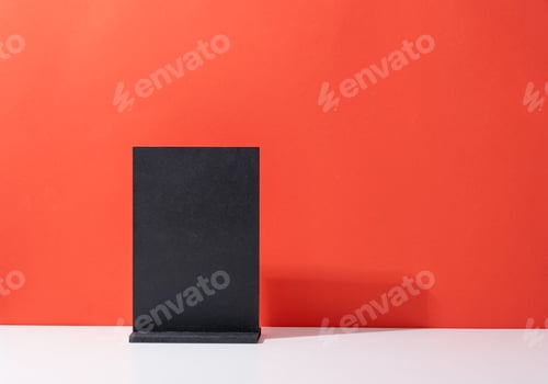 Preview: Black table tent for mockup design on red and white background