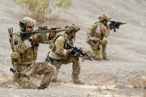 Preview: Close up one of soldier or military sit and point gun to the front of enemy with other in his team