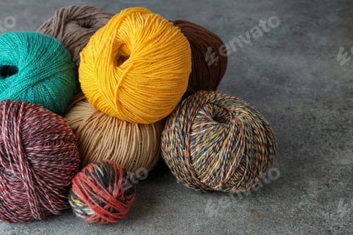 Preview: Many different soft woolen yarns on grey table