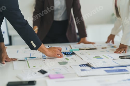 Preview: Business team analyzing financial data and company growth reports