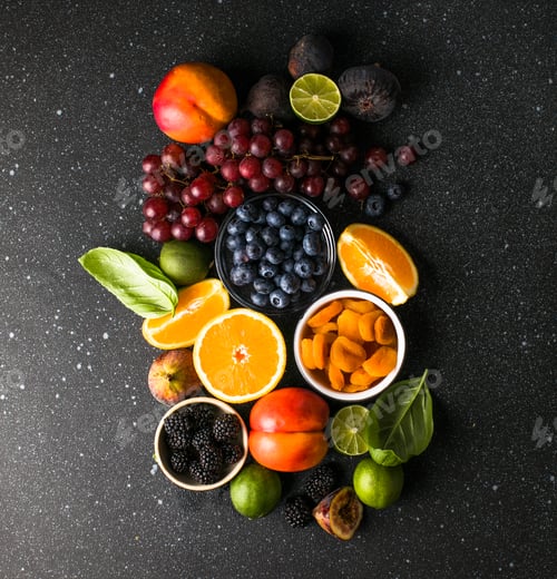 Preview: Assortment of fresh exotic fruits and berries on concrete table, flat lay
