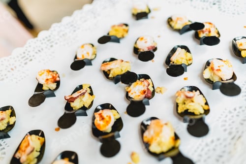 Preview: Appetizers served by a waiter on a tray at a wedding
