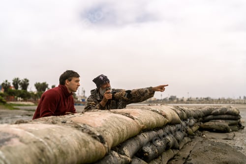 Preview: People birdwatching and photographing wildlife in wetland