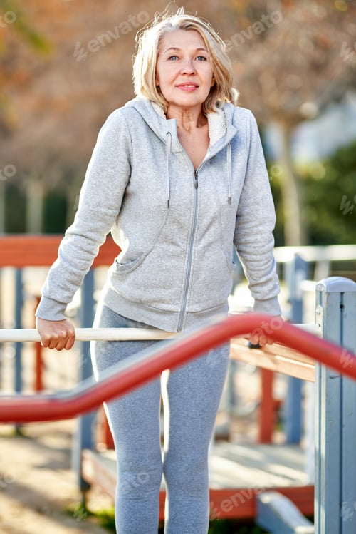 Preview: Sports Woman Senior Citizen Doing Exercises Outdoors