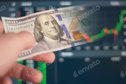 Preview: Conceptual pulling money out of the stock market computer trading screen.