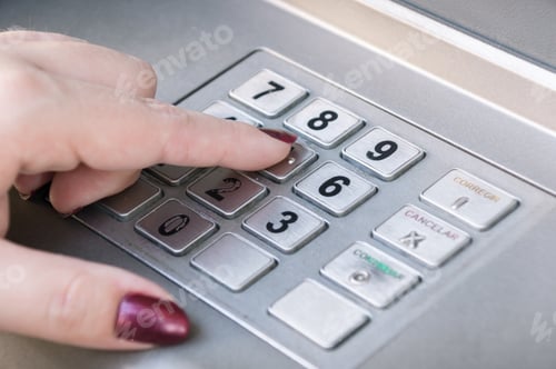 Preview: Closeup shot of a female finger pressings keys on an ATM machine keypad