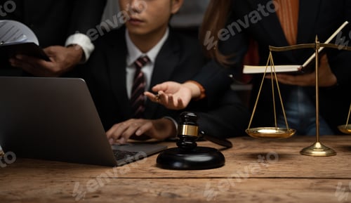 Preview: Close up lawyer businessman working or reading lawbook in office workplace for consultant lawyer con