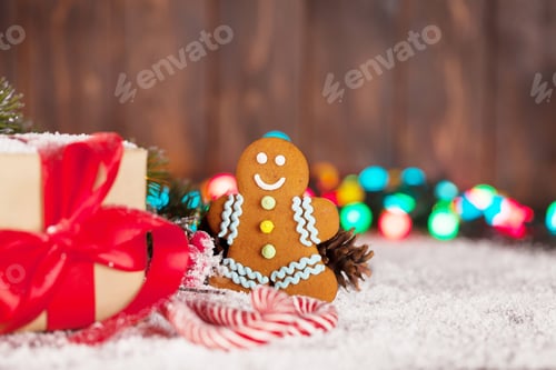 Preview: Christmas gift box, candy canes and gingerbread man