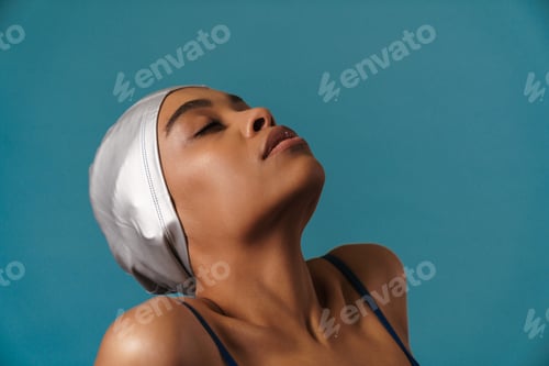 Preview: Young black athletic swimmer posing with eyes closed