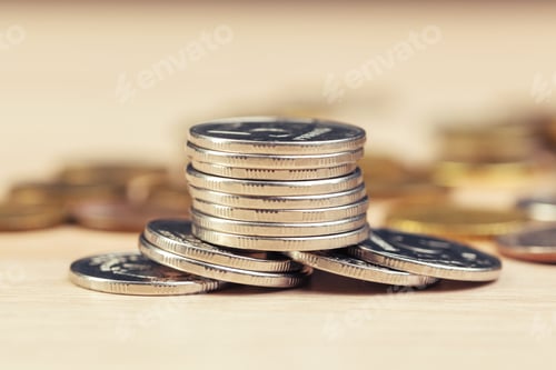 Preview: piles of coins on working table
