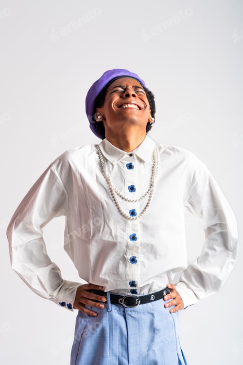 Preview: Fashionable fluid gender man posing in studio
