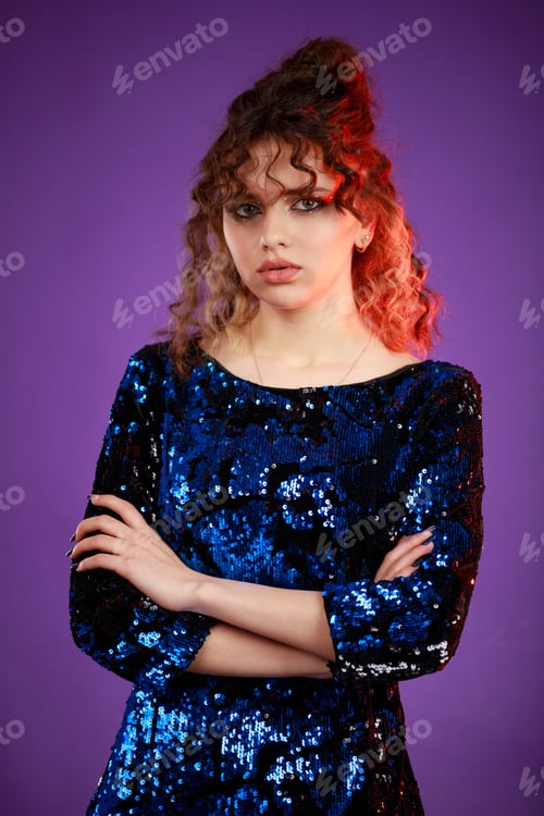 Preview: Young redhead crossed her arms and looking to the camera
