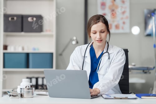 Preview: Woman Doctor Works On Laptop In Office