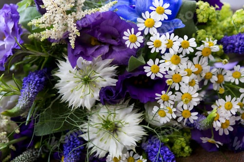 Preview: Close up of a bouquet of blue and white wedding flowers.