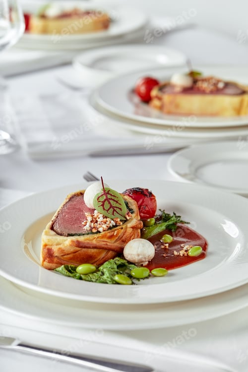 Preview: Easter meat roll, meatloaf for Easter dinner. Beautifully decorated catering banquet table with