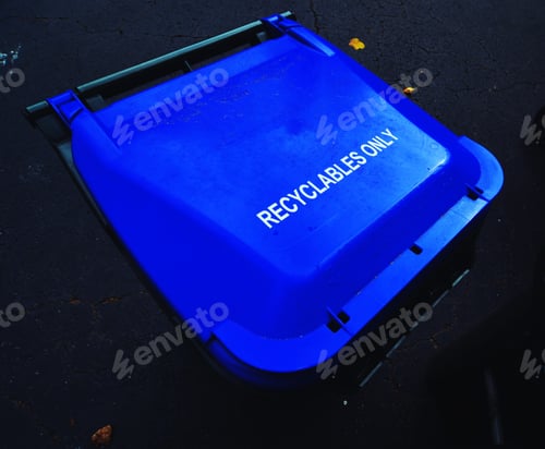 Preview: Blue Recycling Container on Dark Asphalt Surface