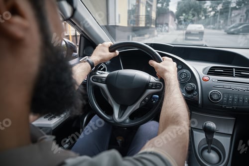 Preview: Man driving and watching the road