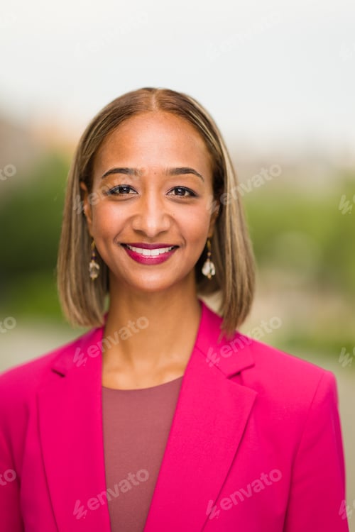 Preview: Smiling Woman in Pink Blazer Outdoor Headshot