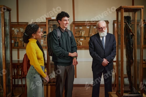Preview: Multiethnic Young Adults and Senior Caucasian Man Visiting Museum Exhibit