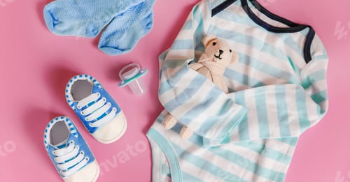 Preview: baby accessories for newborns on a colored background. selective focus.
