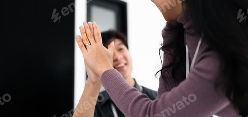 Preview: business team people give high five happy excited in teambuilding celebrate corporate teamwork